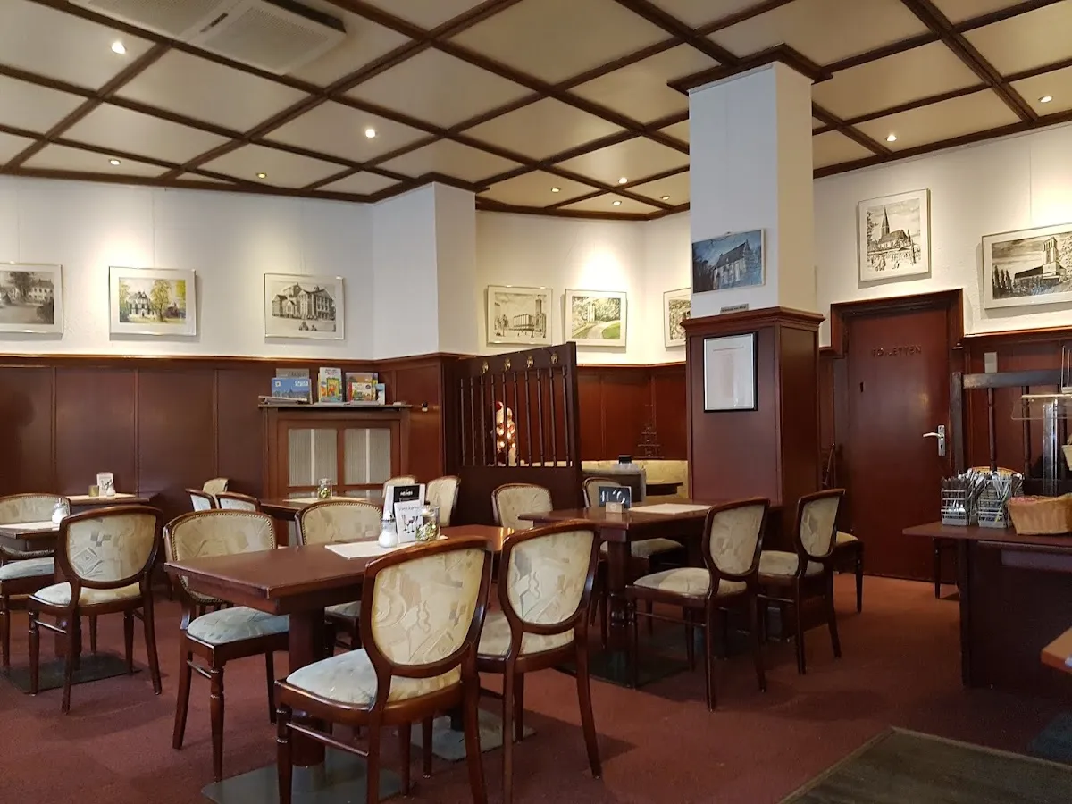 BookNoFees: Restaurace – Café Flores – Hagen – Kavárna Flores, foto 1